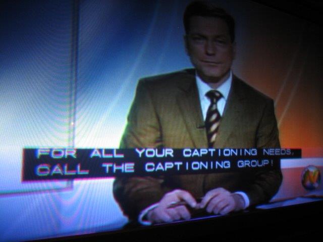 Closed captioning overlaid on a screen, reading "for all your captioning needs call The Captioning Group!"