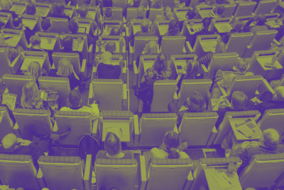 networking conference with people sitting in rows of chairs